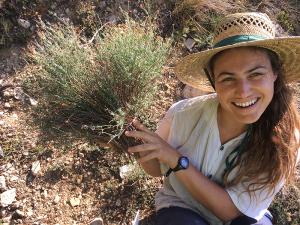 Maya holding resprouted plants